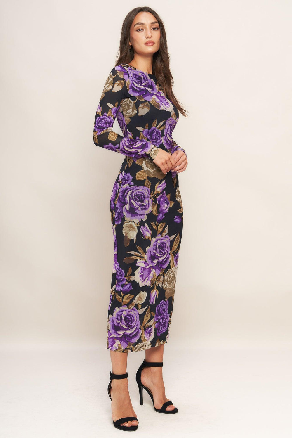 A printed power mesh midi dress featuring body contouring, round neckline, long sleeve and back neck button closure