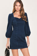Woman wearing a 3/4 balloon sleeve denim mini dress with a sweetheart neckline | Flying Tomato