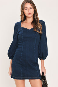 Woman wearing a 3/4 balloon sleeve denim mini dress with a sweetheart neckline | Flying Tomato