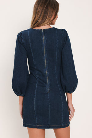 Woman wearing a 3/4 balloon sleeve denim mini dress with a sweetheart neckline | Flying Tomato