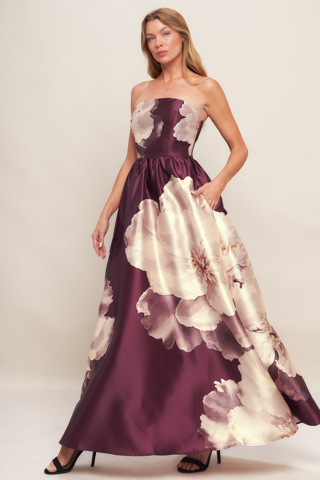 A printed woven maxi dress featuring strapless neckline, full skirt and smocked back bodice