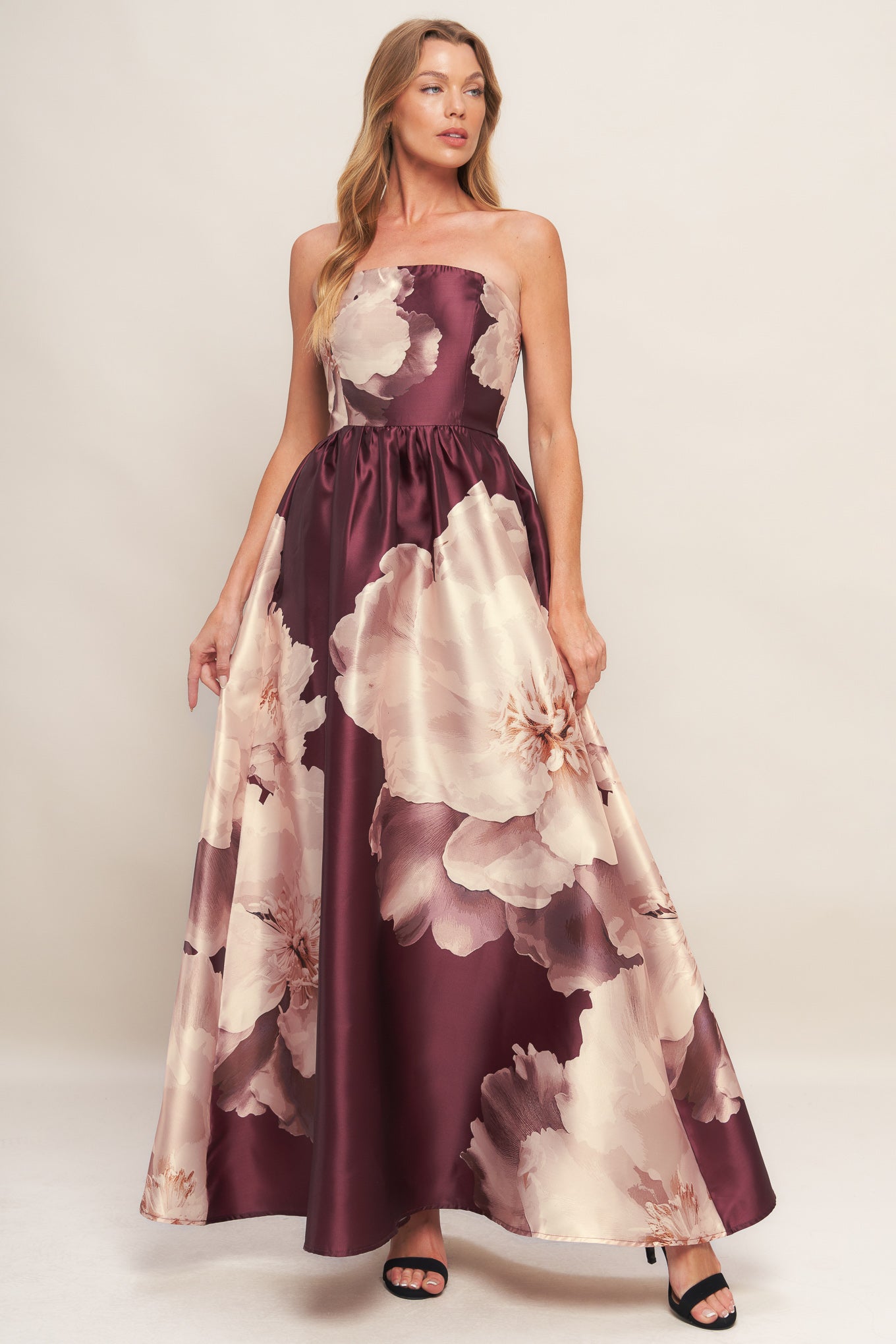A printed woven maxi dress featuring strapless neckline, full skirt and smocked back bodice