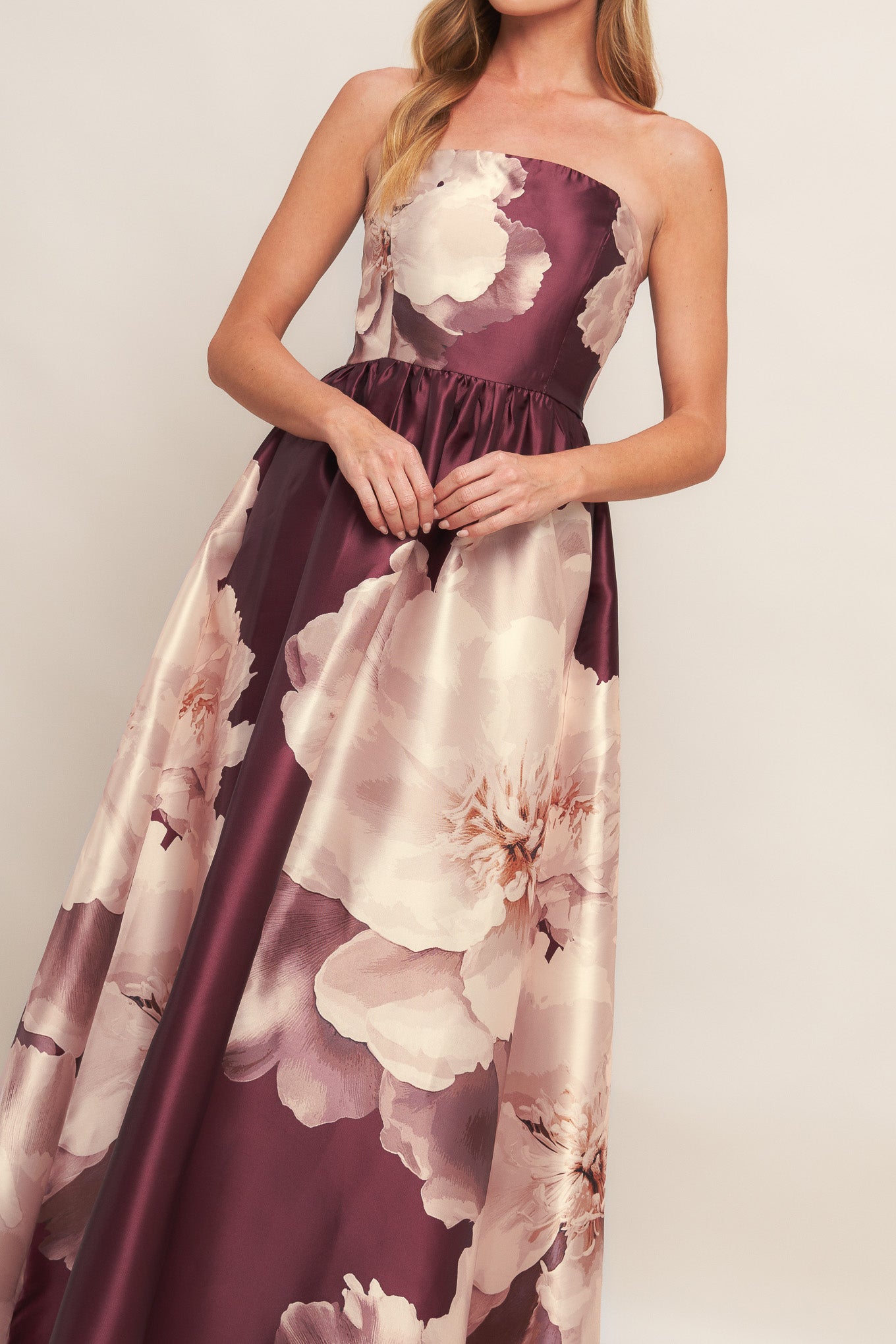 A printed woven maxi dress featuring strapless neckline, full skirt and smocked back bodice