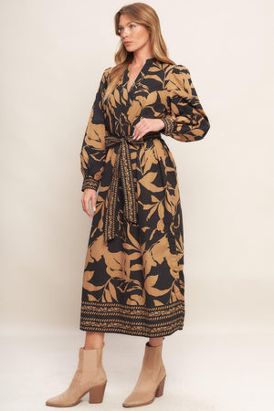 A printed woven midi dress featuring high neckline with V front, short puff sleeve and self sash tie