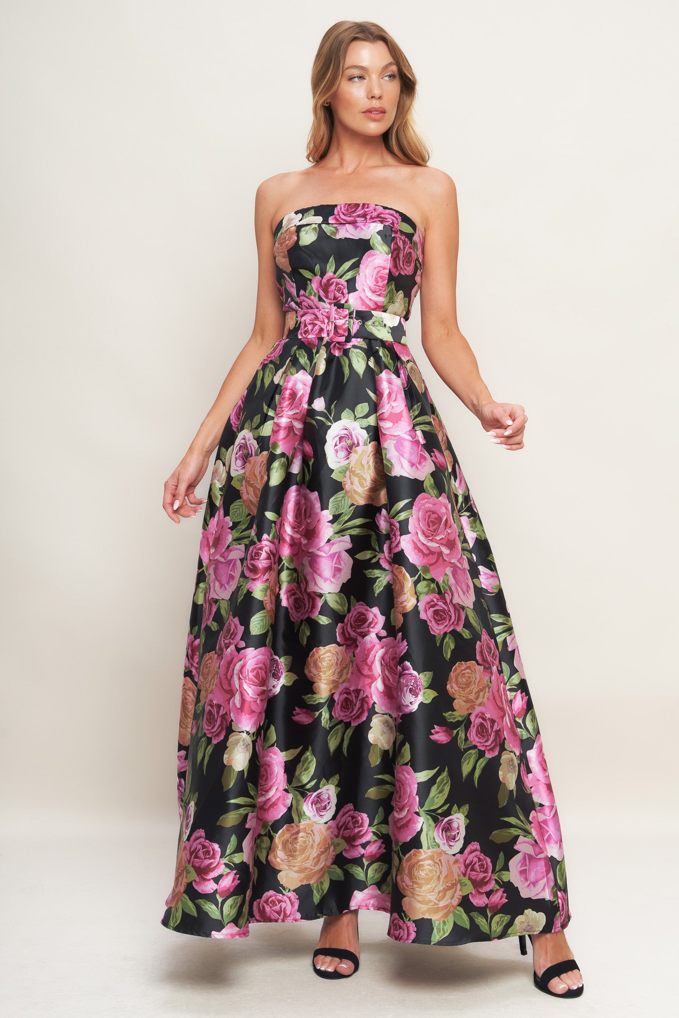 A printed woven maxi dress featuring strapless neckline, self belt, full skirt and back zipper closure