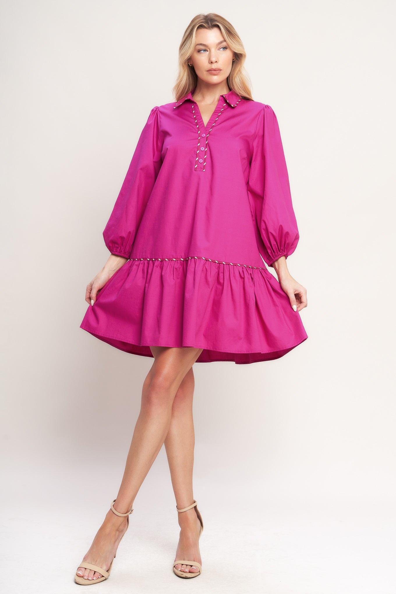 A solid woven mini dress featuring collar, V neck with button down, long sleeve and ruffled hem

Details:

Self: 100% Cotton

Size & Fit

-Model is 5`8" And Wearing Size Small
-Measurements Taken From Size Small
-Approx. Length: 36"