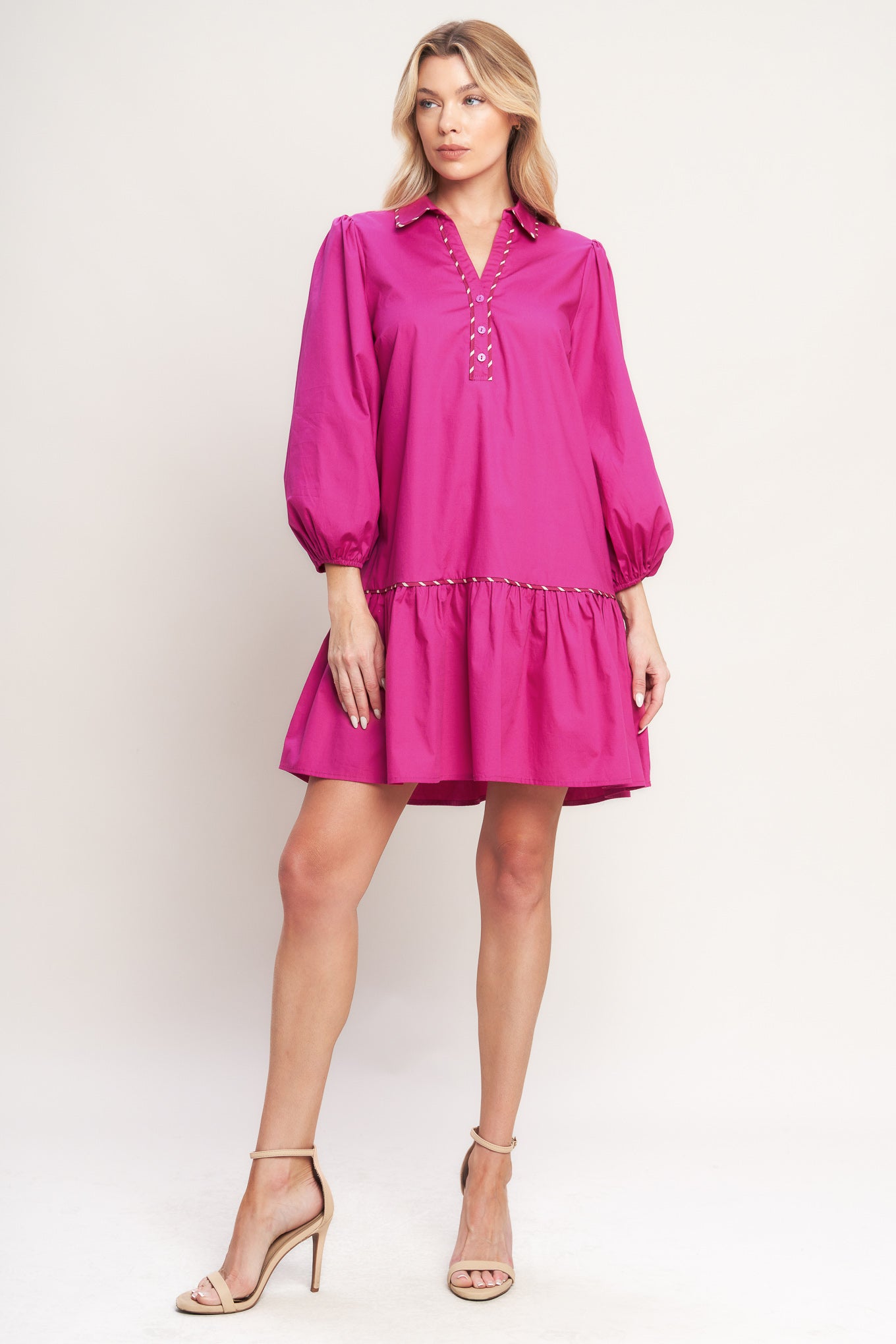 A solid woven mini dress featuring collar, V neck with button down, long sleeve and ruffled hem

Details:

Self: 100% Cotton

Size & Fit

-Model is 5`8" And Wearing Size Small
-Measurements Taken From Size Small
-Approx. Length: 36"