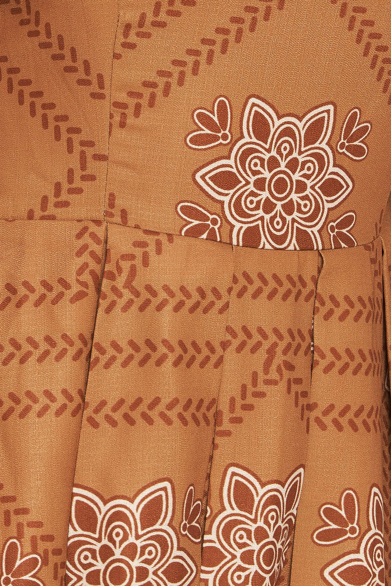 A printed woven midi dress featuring square neckline, long sleeve with smocked cuff, full skirt and smocked back bodice