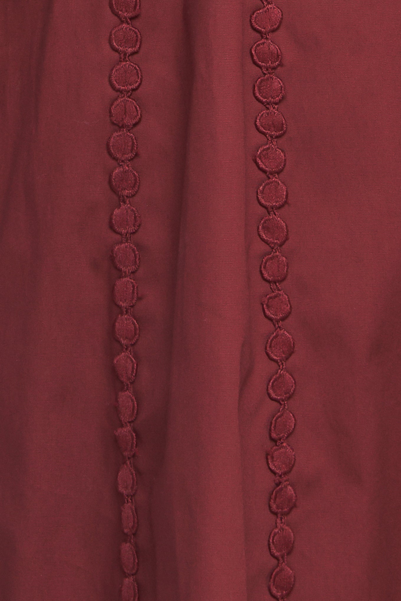 A solid woven midi dress featuring collar, button down, lace trim detail, long sleeve, self belt and full skirt