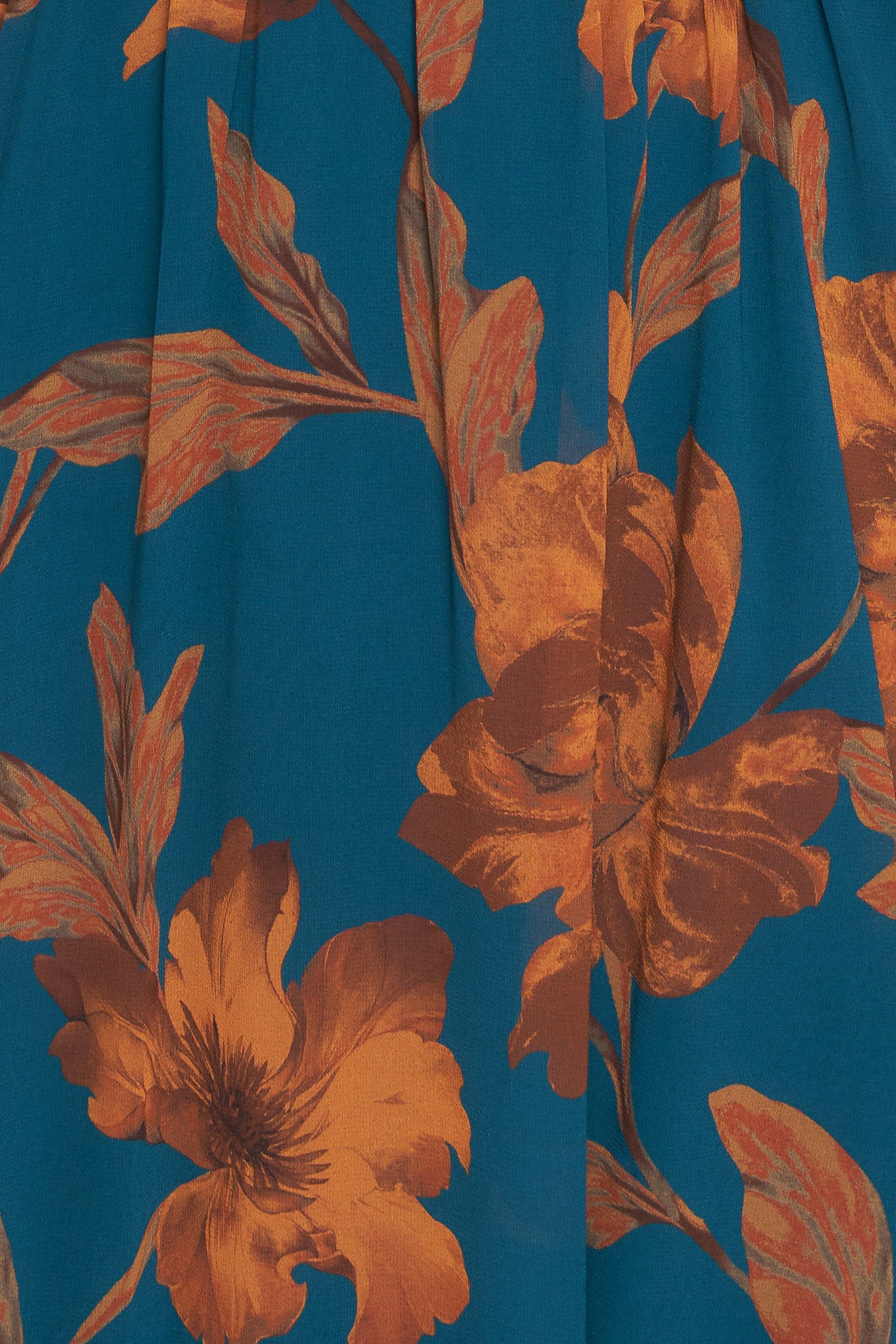 A printed woven midi dress featuring front tie/tassel with ruffles, long sleeve with ruffled cuff and elasticized waist