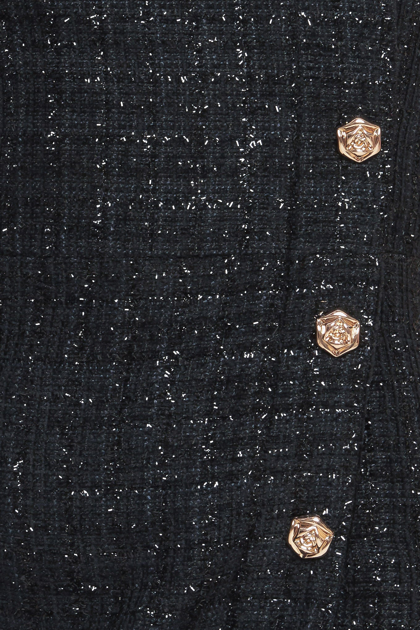 A tweed mini dress featuring strapless neckline, button down detail and back zipper closure