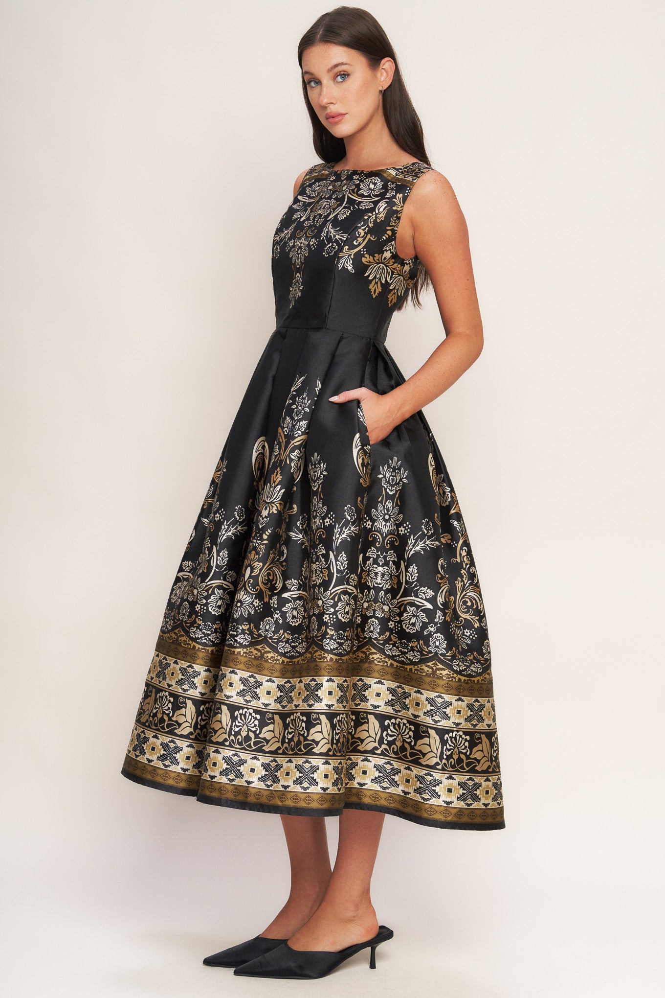 A printed woven midi dress featuring round neckline, sleeveless, full skirt and back zipper closure
