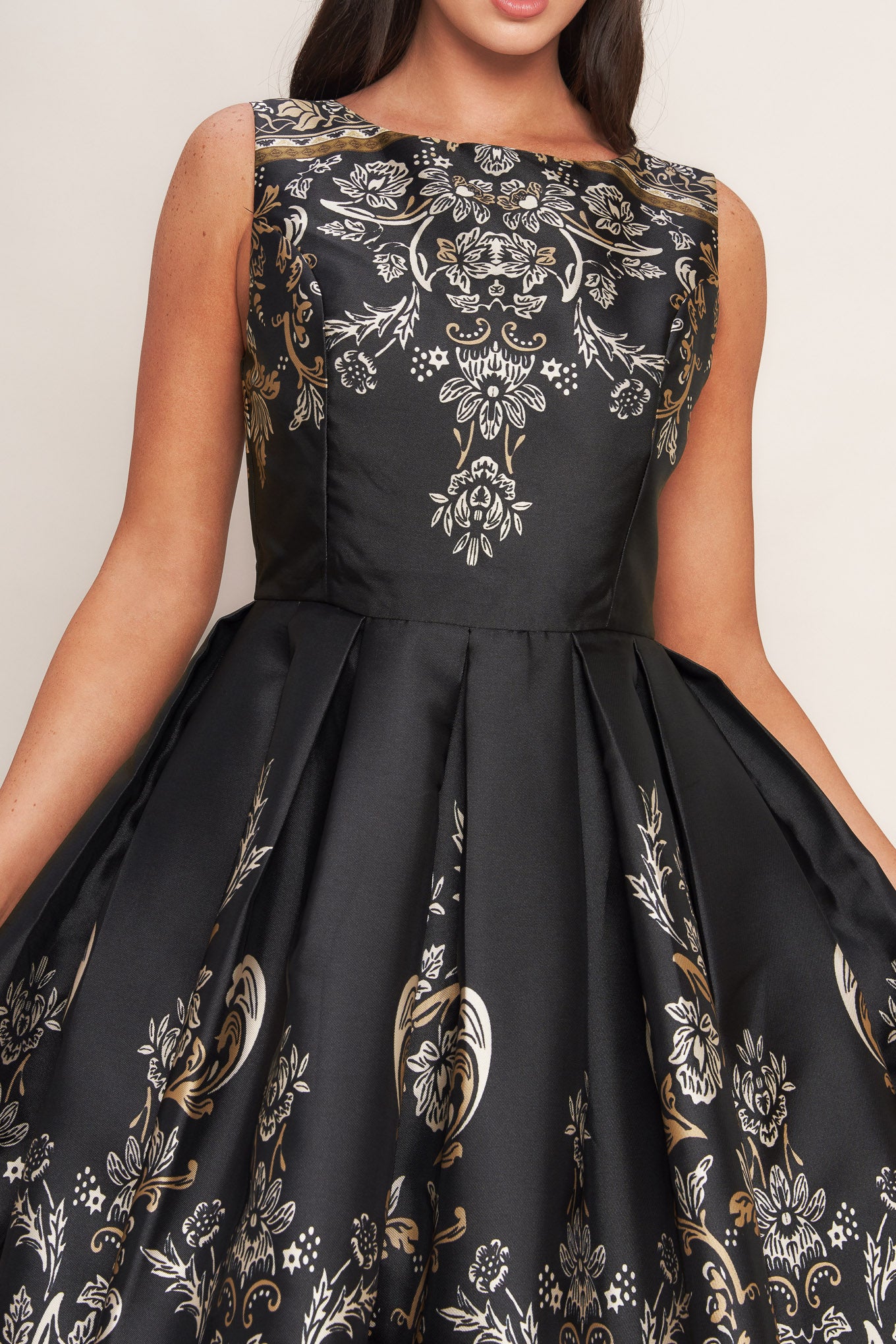A printed woven midi dress featuring round neckline, sleeveless, full skirt and back zipper closure