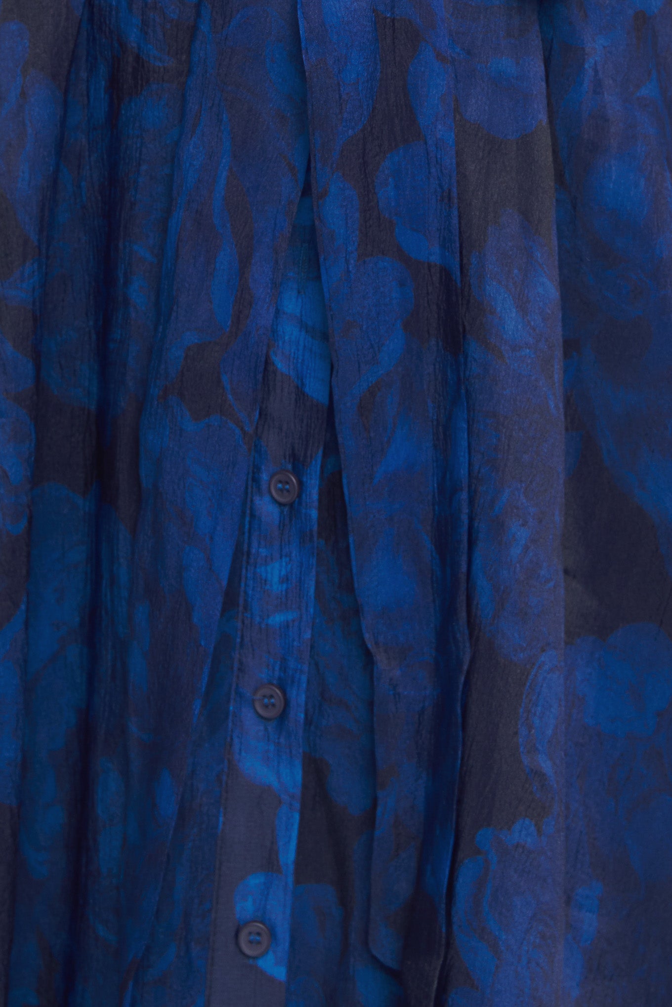 A printed woven midi dress featuring collar, front button down, short puff sleeve, self sash tie and full skirt