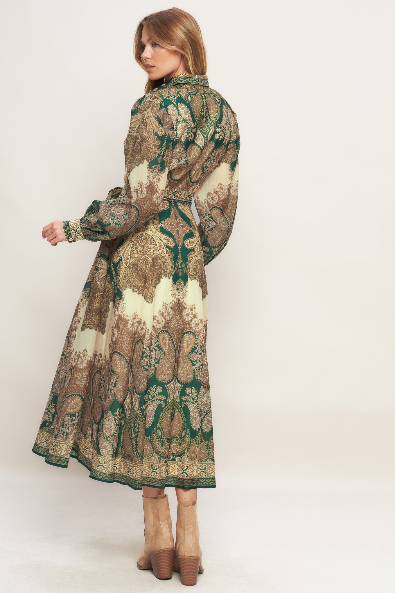 A printed woven midi dress featuring collar, front button down closure, long sleeve with cuff and circle skirt