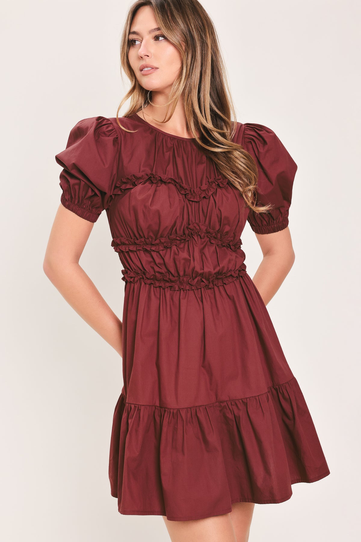 Woman wearing a maroon short puff sleeve mini dress | Flying Tomato