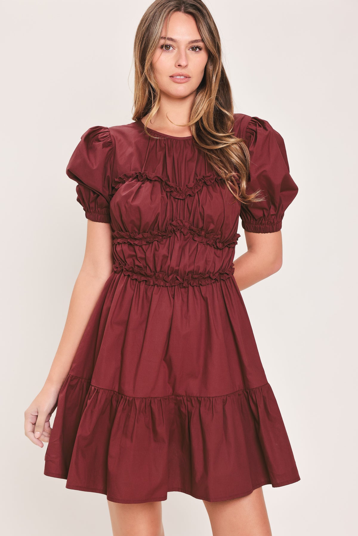 Woman wearing a maroon short puff sleeve mini dress | Flying Tomato
