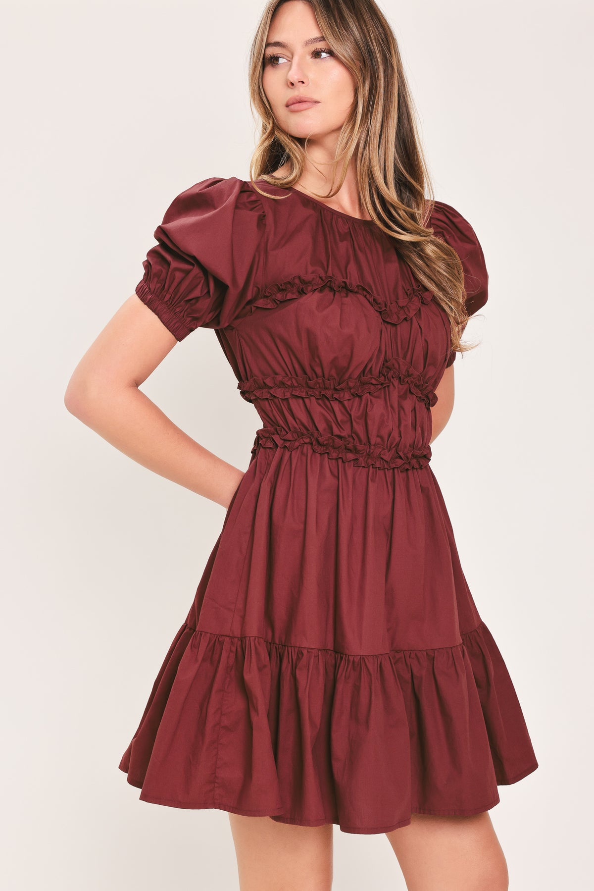 Woman wearing a maroon short puff sleeve mini dress | Flying Tomato