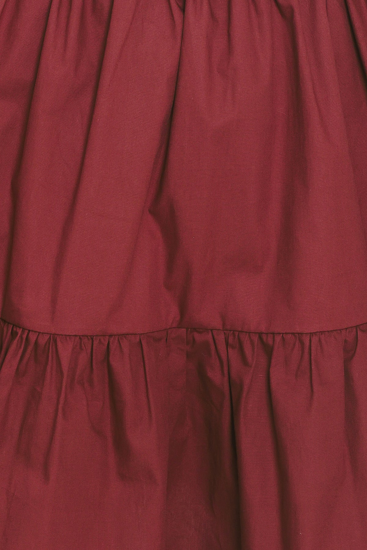 Woman wearing a maroon short puff sleeve mini dress | Flying Tomato