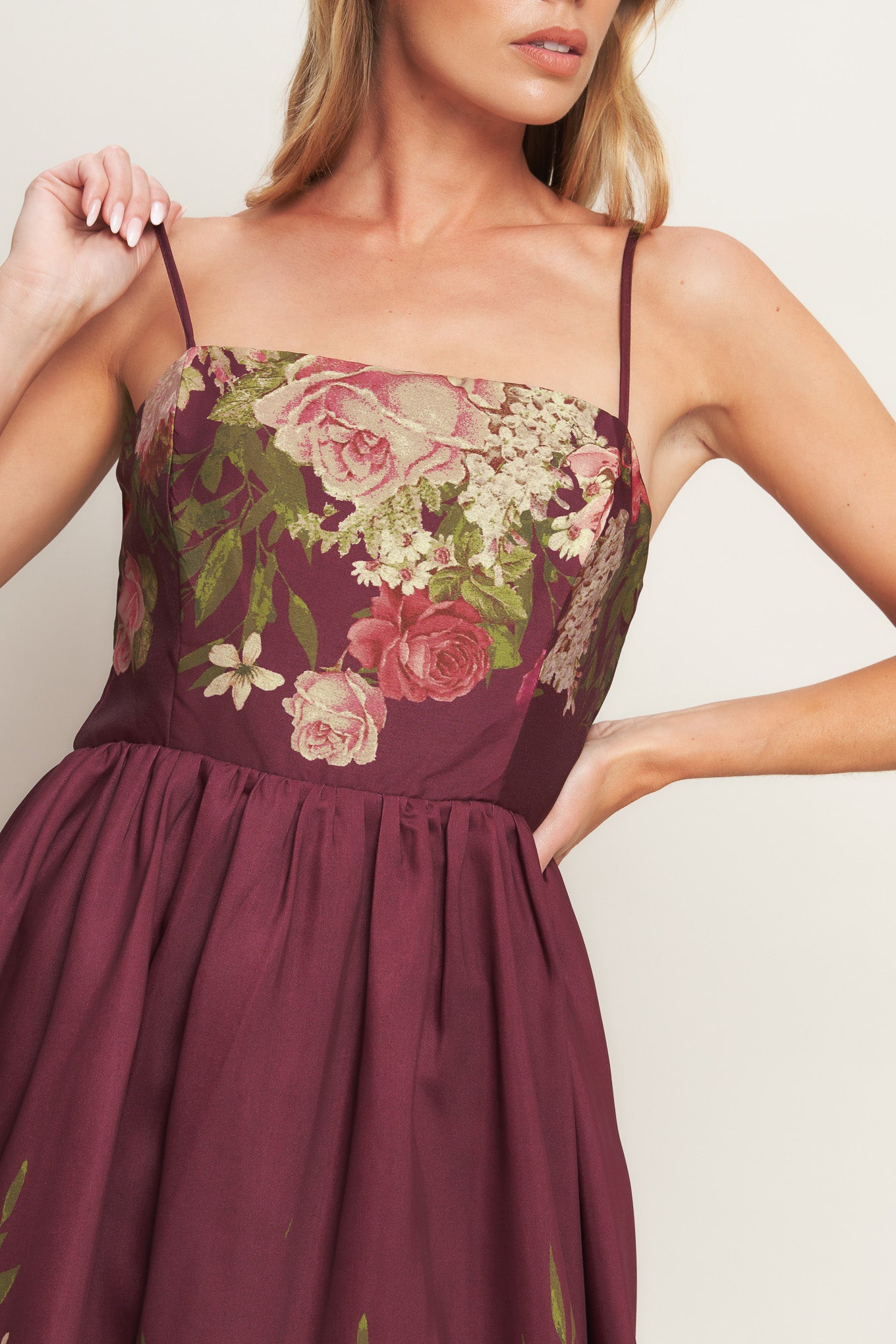 A printed woven ankle dress featuring straight neckline, straps, full skirt and back zipper closure