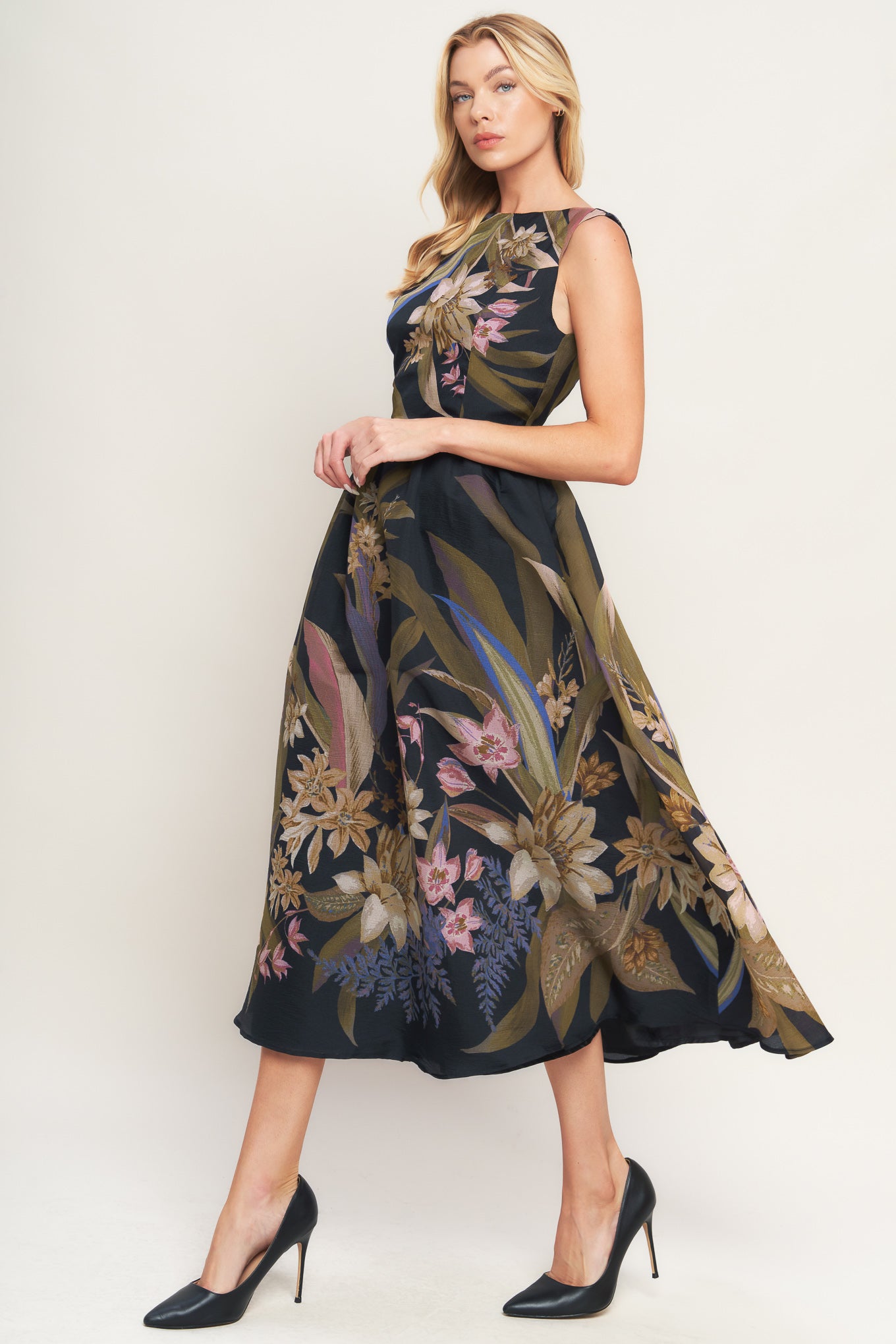 A printed woven midi dress featuring wide neckline, sleeveless, full skirt and back zipper closure