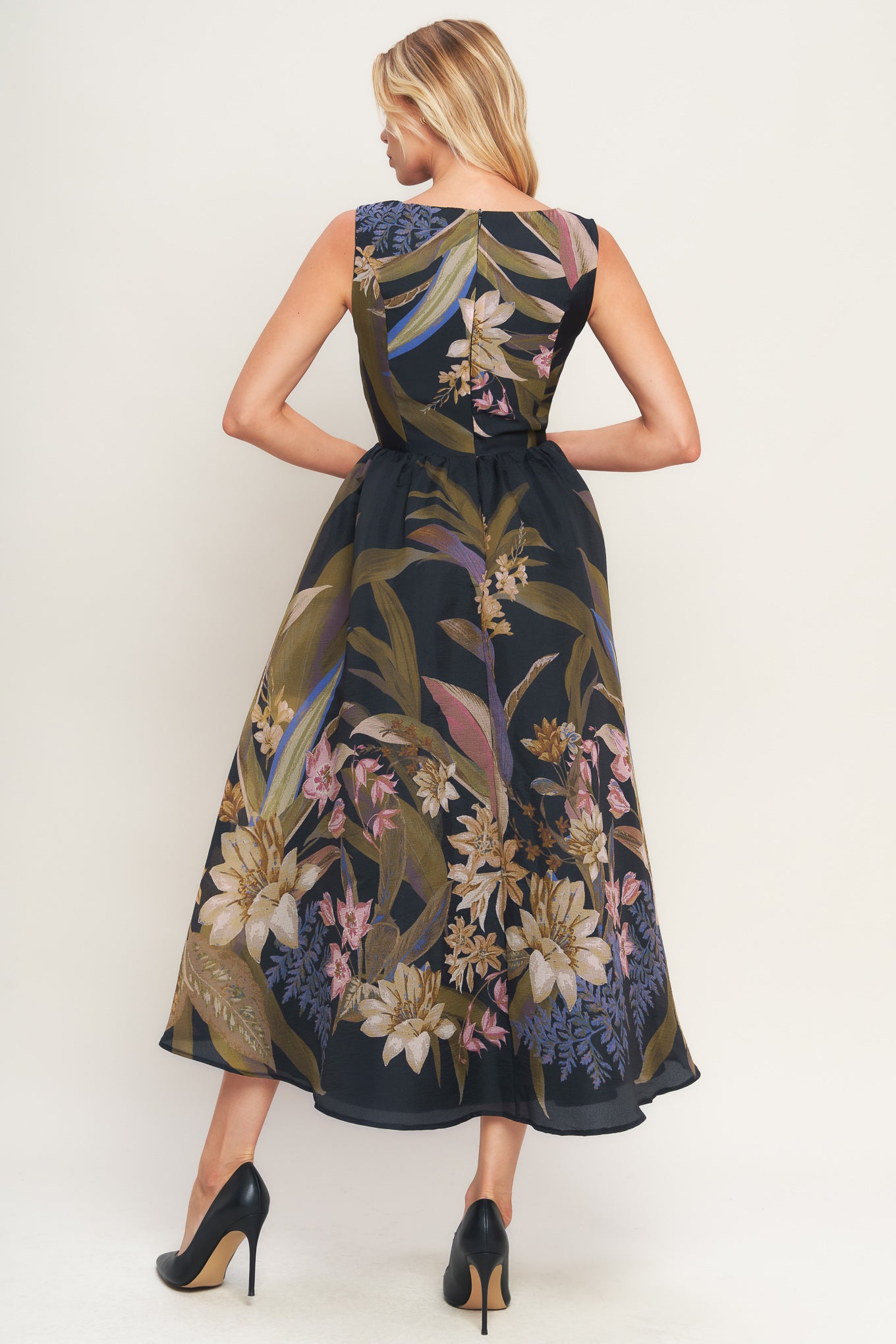 A printed woven midi dress featuring wide neckline, sleeveless, full skirt and back zipper closure