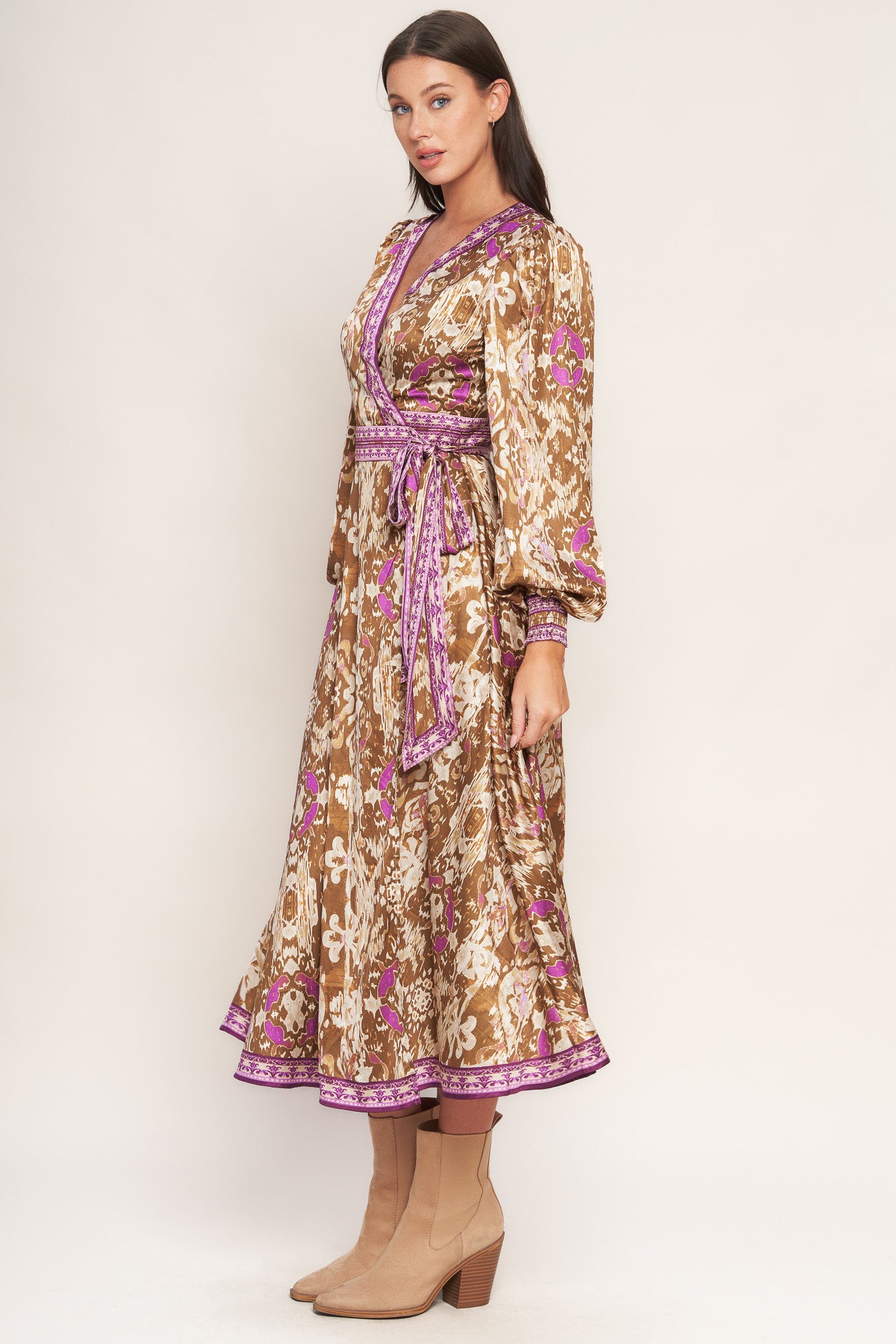 A printed woven midi true wrap dress featuring surplice neckline and long sleeve with smocked cuff