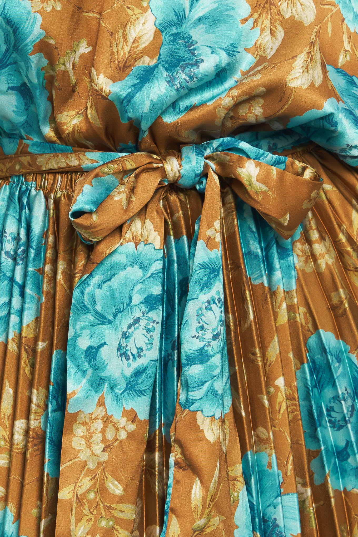 A printed woven satin maxi dress featuring round neckline, long sleeve, elasticized waist with pleated skirt and back button closure