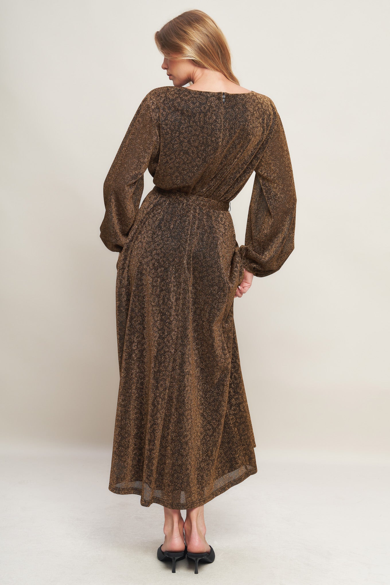 A metallic threaded woven midi dress featuring wide neckline, long blouson sleeve, self sash tie and back zipper closure