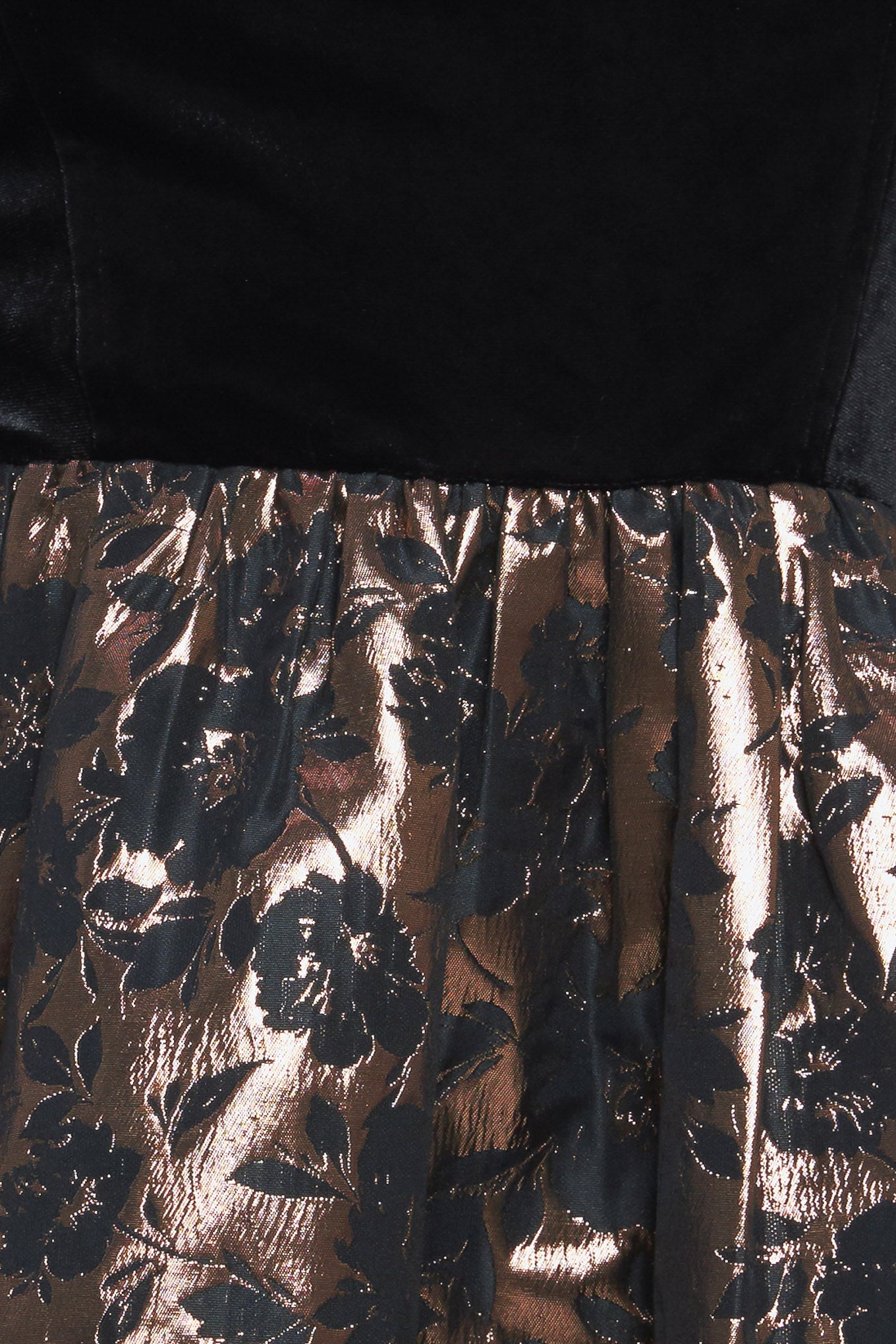 A velvet/woven mini dress featuring straight neckline with shoulder ties, full skirt and back zipper closure