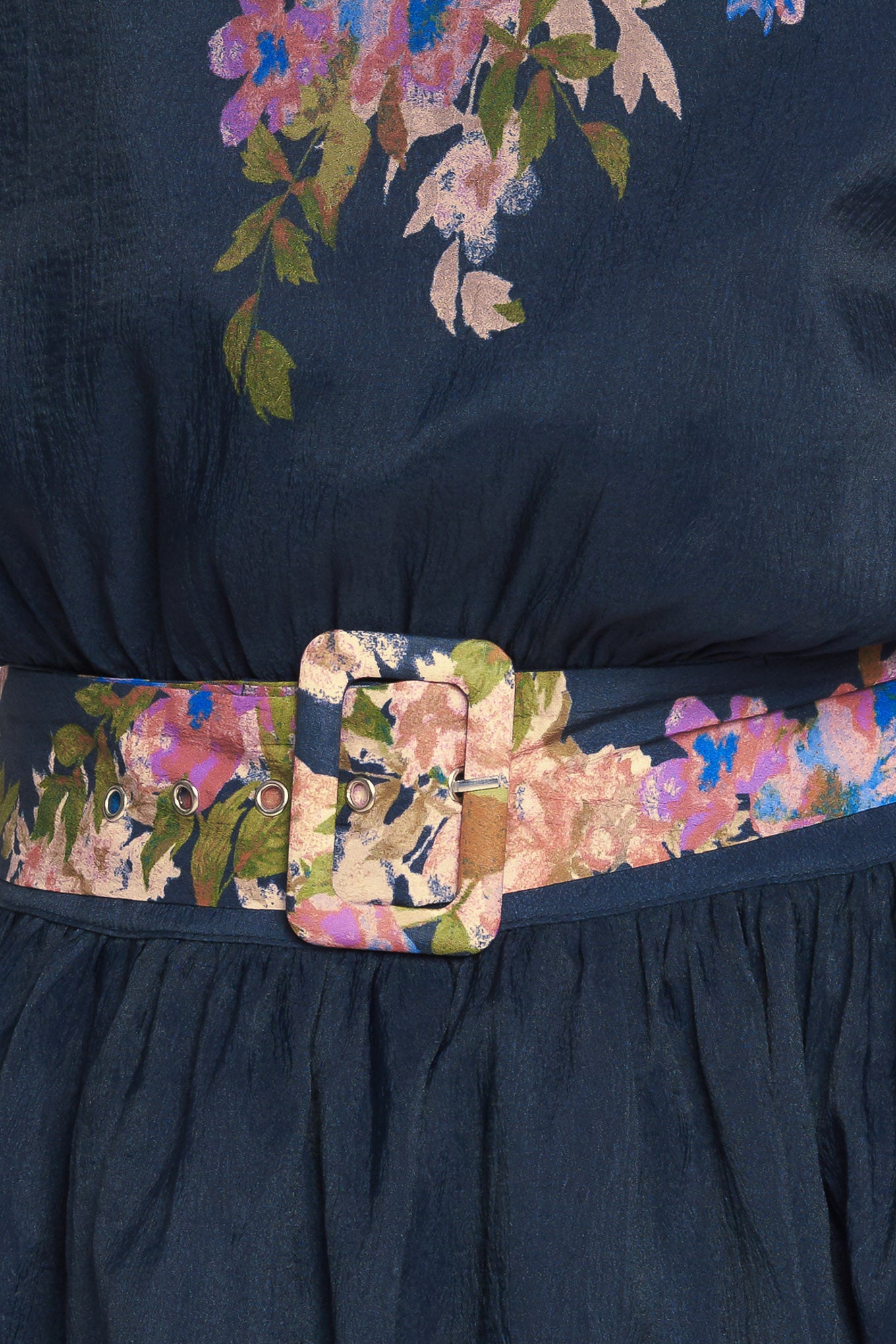 A printed woven midi dress featuring round neckline, long sleeve with wide cuff, waist band, full skirt and back zipper closure