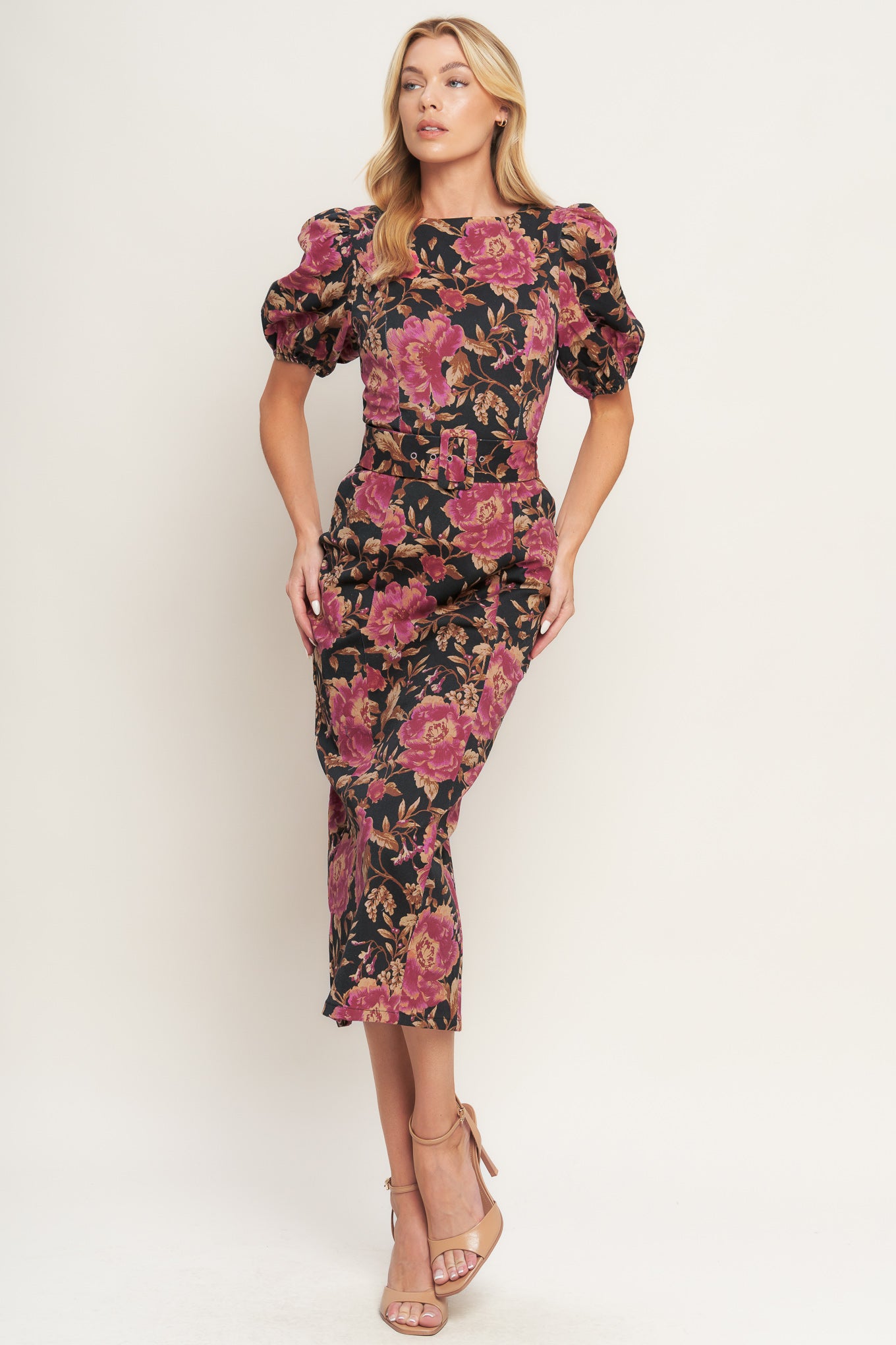 A printed woven midi dress featuring wide neckline, short puff sleeve, self belt, pencil skirt and back zipper closure