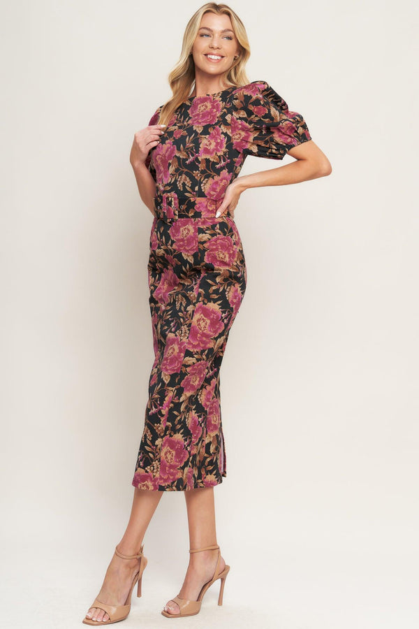 A printed woven midi dress featuring wide neckline, short puff sleeve, self belt, pencil skirt and back zipper closure