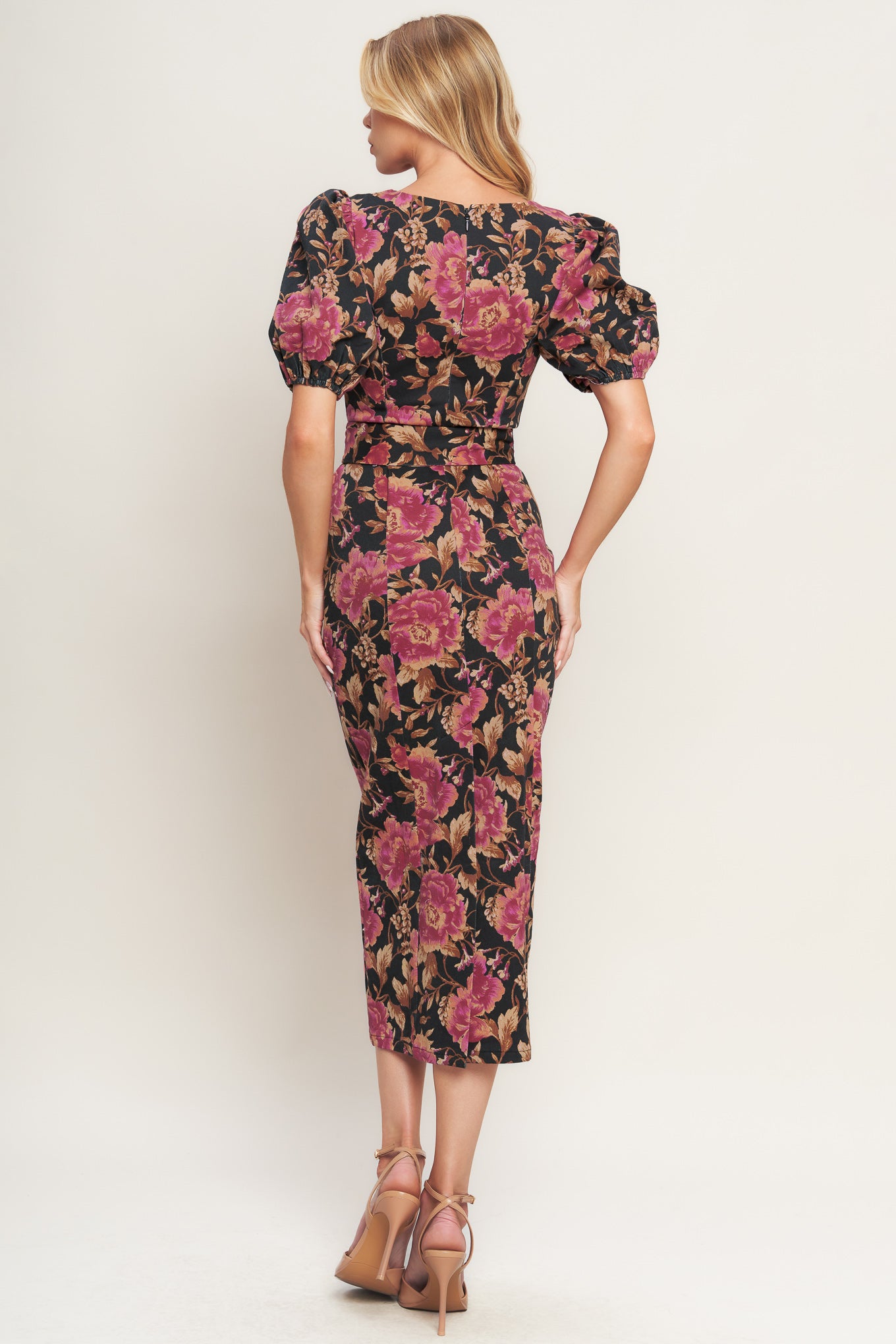 A printed woven midi dress featuring wide neckline, short puff sleeve, self belt, pencil skirt and back zipper closure