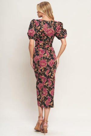 A printed woven midi dress featuring wide neckline, short puff sleeve, self belt, pencil skirt and back zipper closure