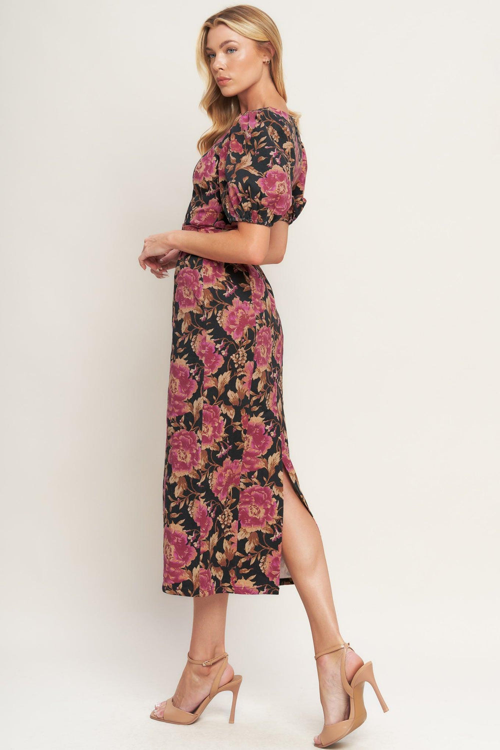 A printed woven midi dress featuring wide neckline, short puff sleeve, self belt, pencil skirt and back zipper closure