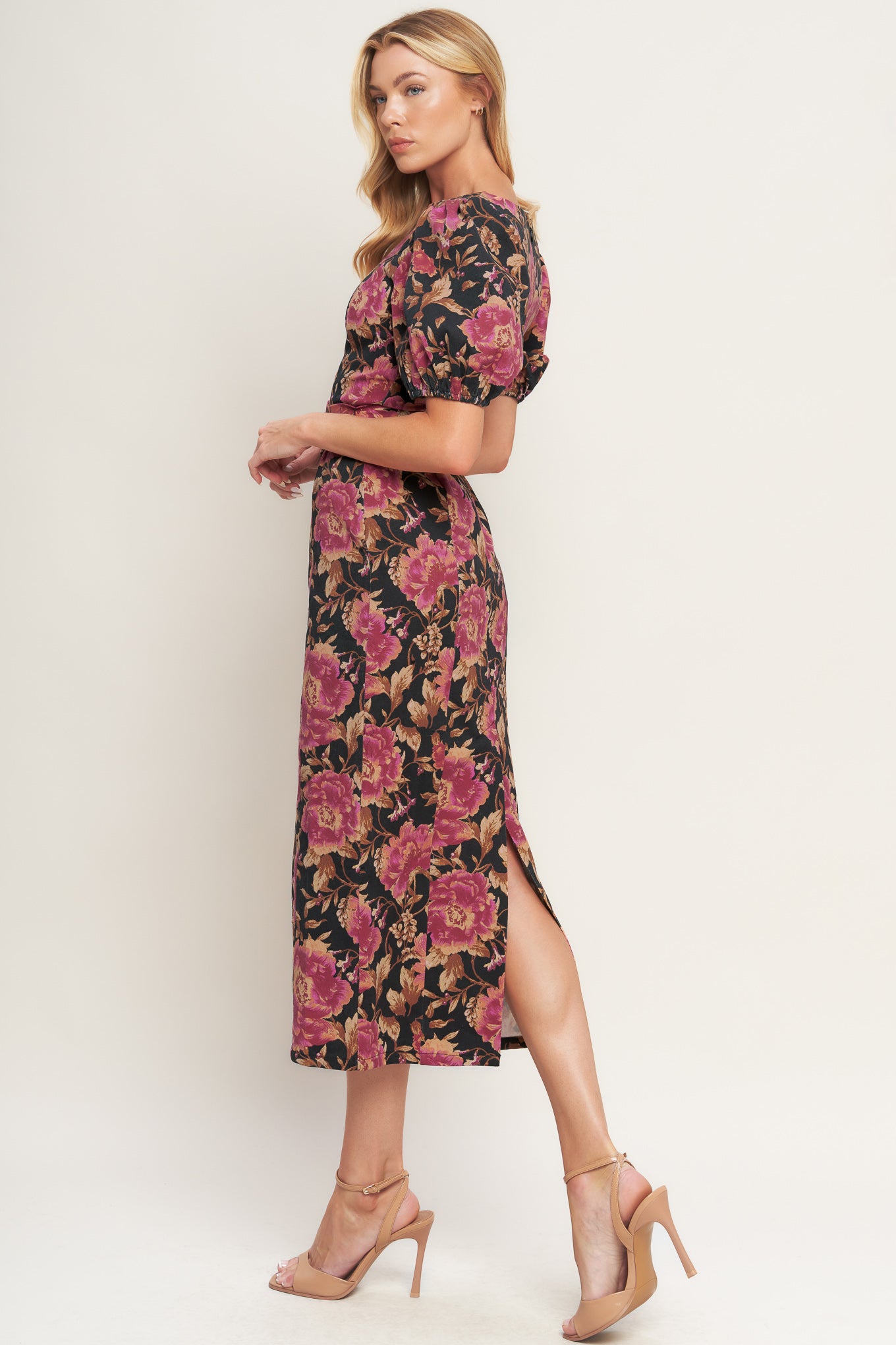 A printed woven midi dress featuring wide neckline, short puff sleeve, self belt, pencil skirt and back zipper closure