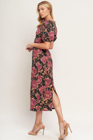 A printed woven midi dress featuring wide neckline, short puff sleeve, self belt, pencil skirt and back zipper closure