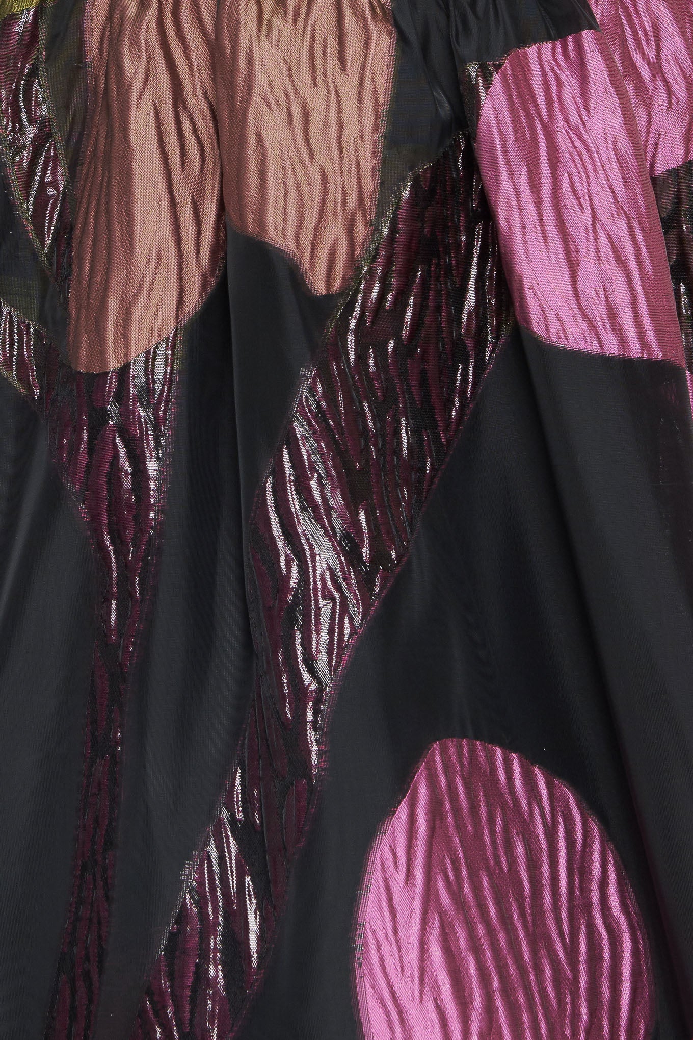 A solid and printed woven midi dress featuring solid tube top, printed full skirt and back zipper closure