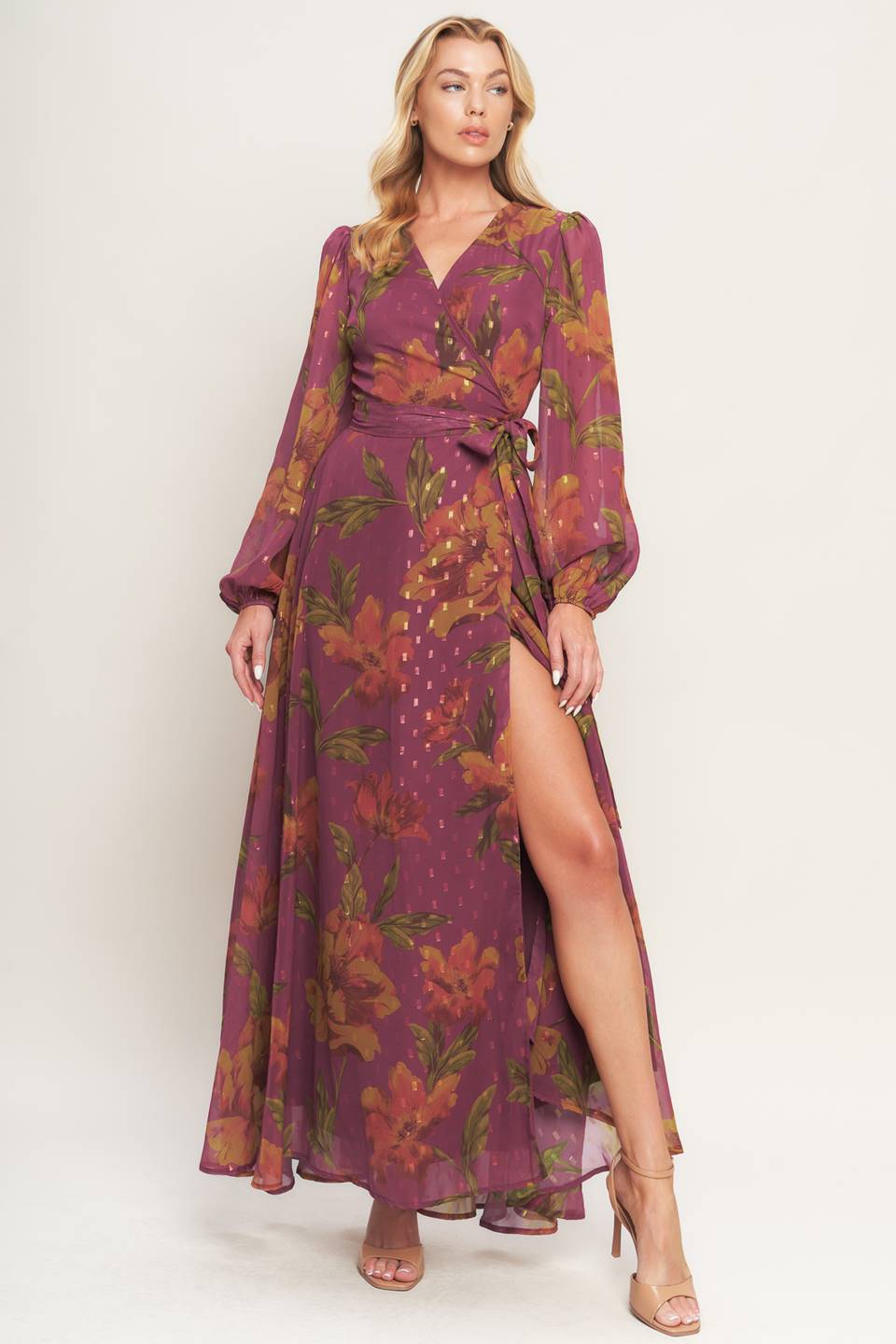 A textured printed woven maxi dress featuring surplice neckline, long sleeve and true wrap with tie