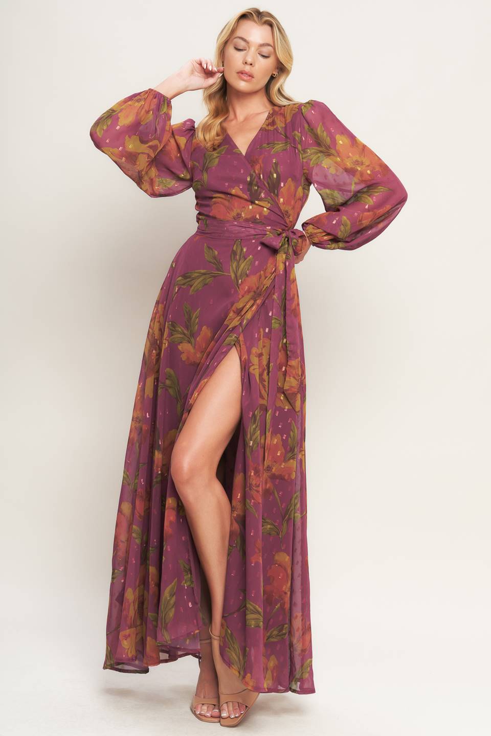 A textured printed woven maxi dress featuring surplice neckline, long sleeve and true wrap with tie