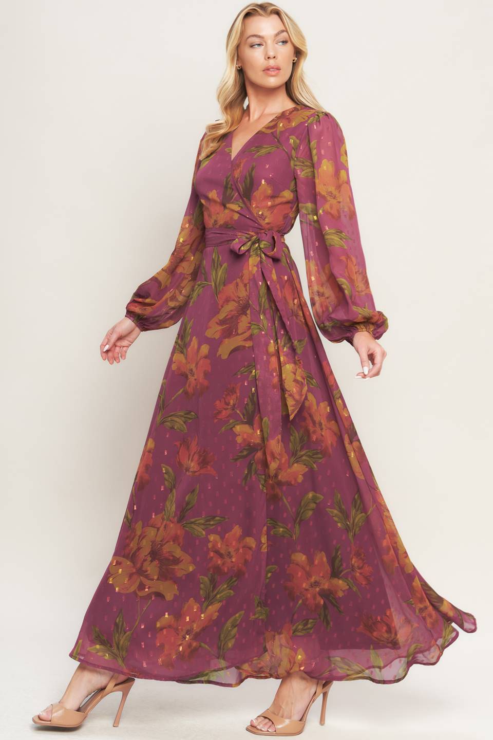 A textured printed woven maxi dress featuring surplice neckline, long sleeve and true wrap with tie