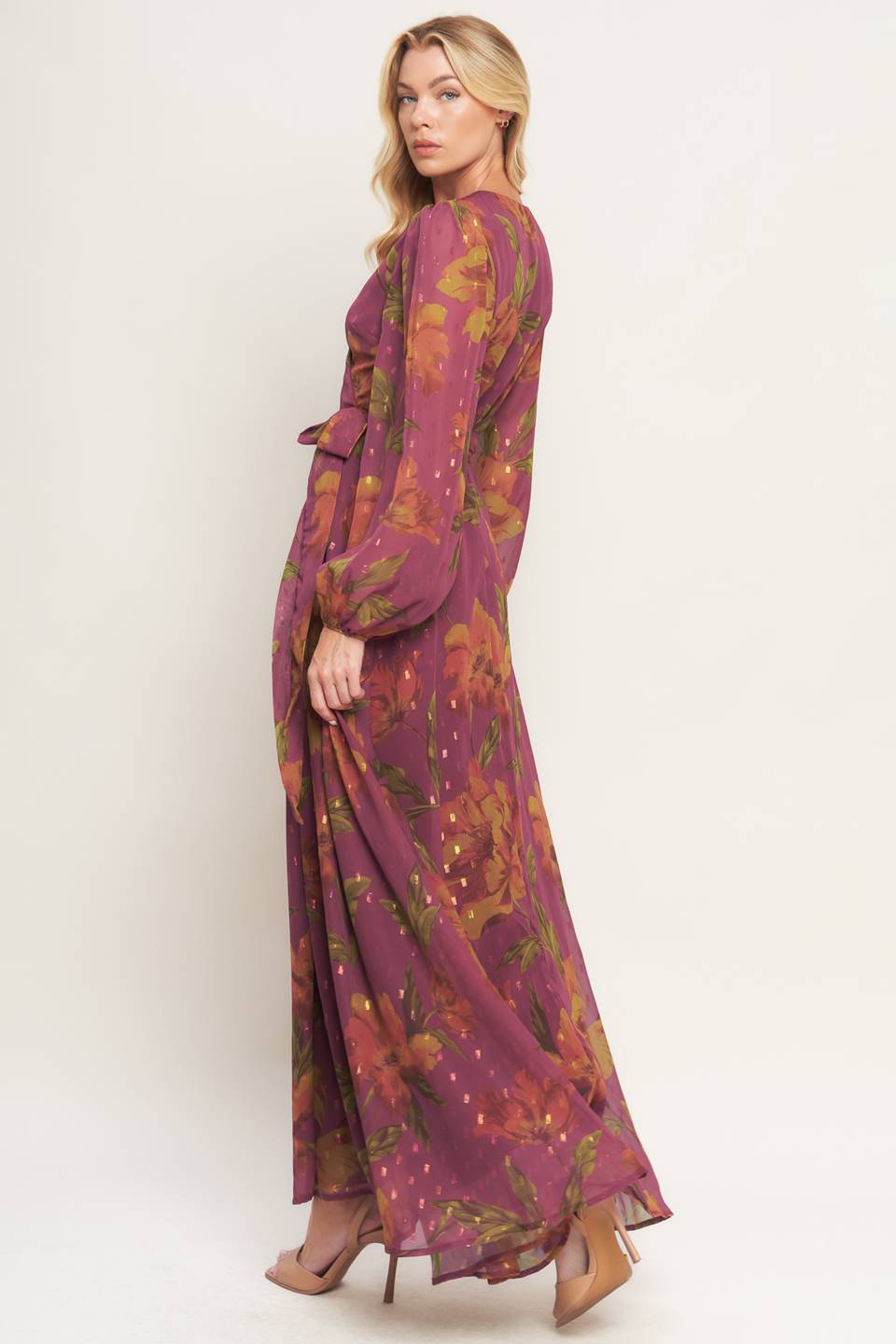 A textured printed woven maxi dress featuring surplice neckline, long sleeve and true wrap with tie