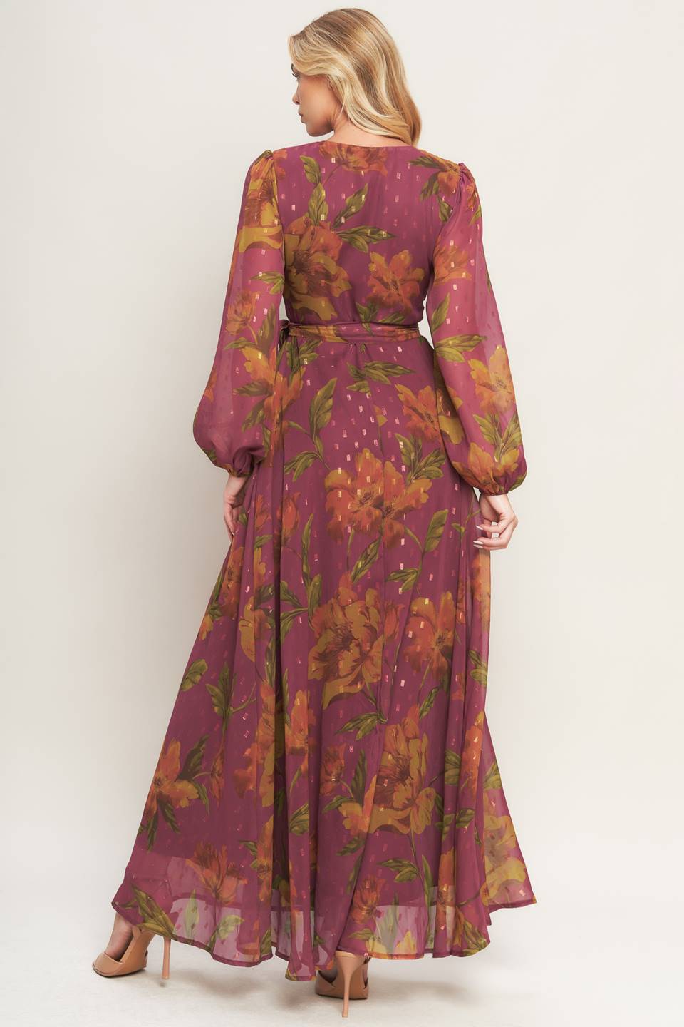 A textured printed woven maxi dress featuring surplice neckline, long sleeve and true wrap with tie