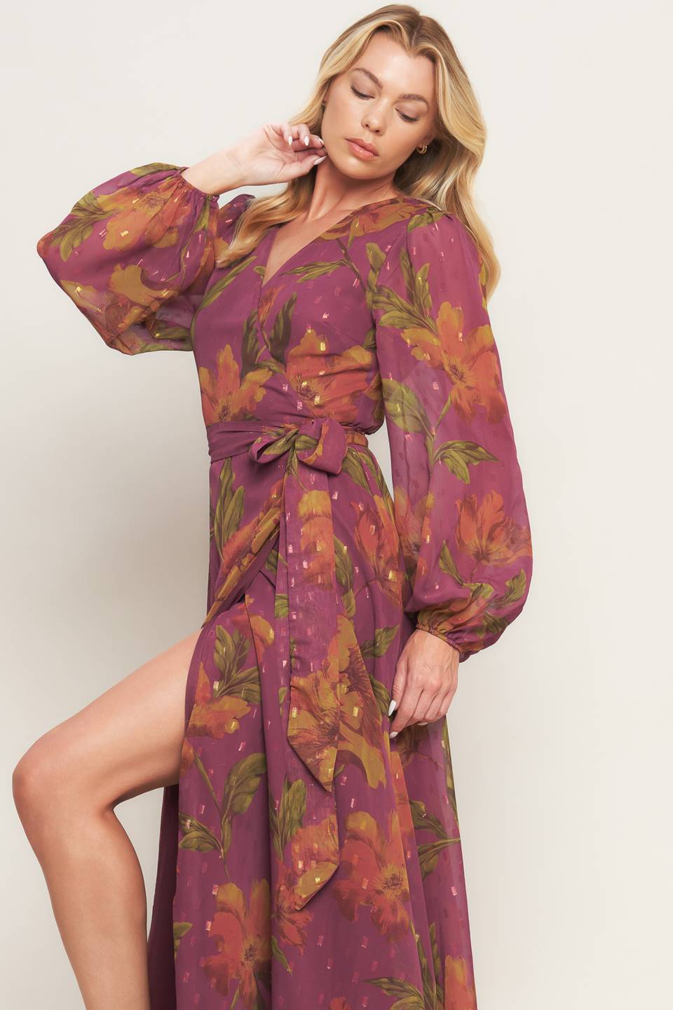 A textured printed woven maxi dress featuring surplice neckline, long sleeve and true wrap with tie