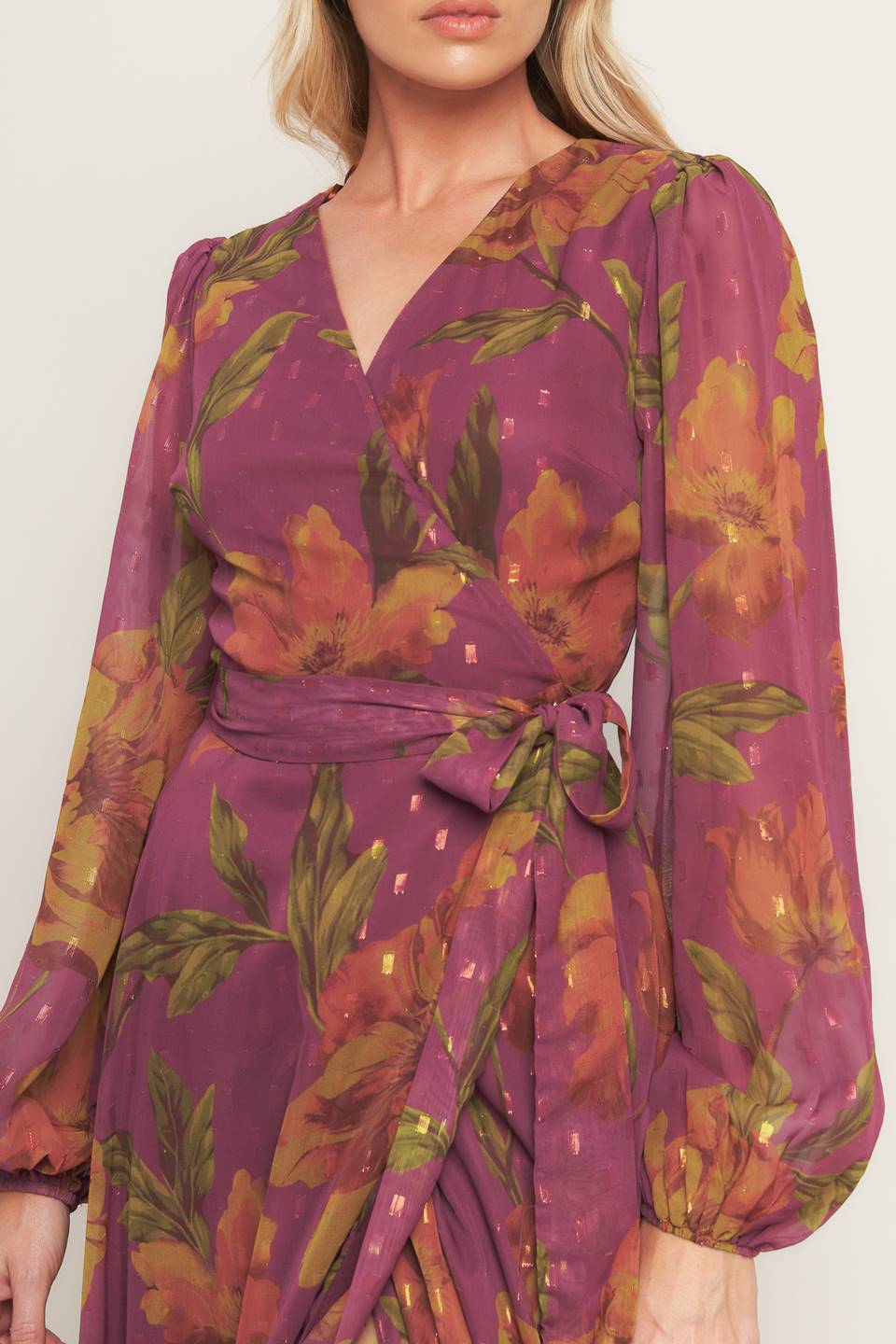 A textured printed woven maxi dress featuring surplice neckline, long sleeve and true wrap with tie