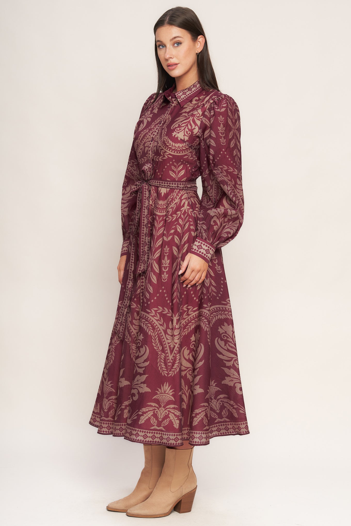 A printed woven midi dress featuring collar, front button down closure, long sleeve with circle skirt