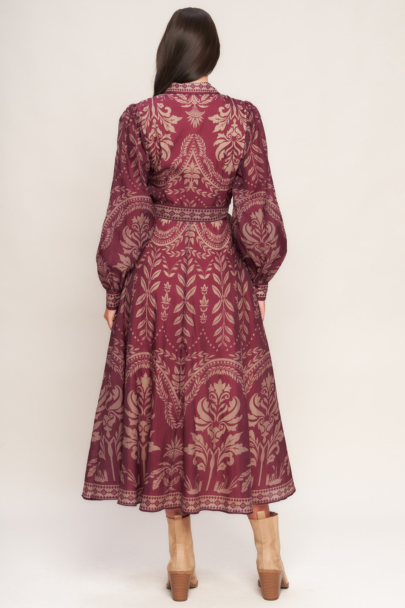 A printed woven midi dress featuring collar, front button down closure, long sleeve with circle skirt