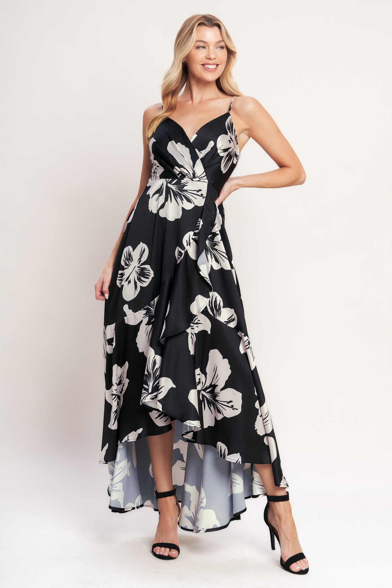 A printed woven maxi dress featuring surplice cami top, faux wrap with ruffle hem and back zipper closure

Details:

Self: 100% Polyester
Lining: 100% Polyester

Size & Fit

- Model is 5`8" And Wearing Size Small
- Measurements Taken From Size Small
- Approx. Length: 59"