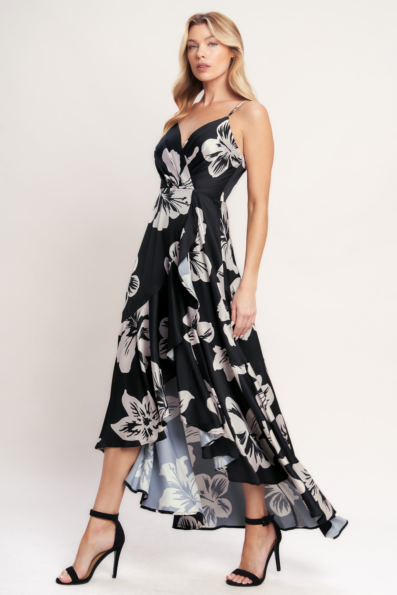 A printed woven maxi dress featuring surplice cami top, faux wrap with ruffle hem and back zipper closure

Details:

Self: 100% Polyester
Lining: 100% Polyester

Size & Fit

- Model is 5`8" And Wearing Size Small
- Measurements Taken From Size Small
- Approx. Length: 59"